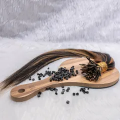 Here are I-tip extensions with micro beads, ready for application. The highlighted strands show how you can add color and dimension without any chemicals, all while getting a fuller look.