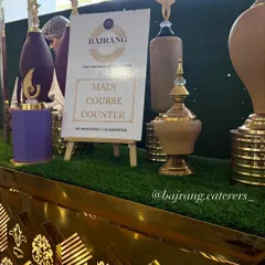 Details matter. I use custom signage and decorative elements like these ornate urns to clearly label food stations and enhance the theme of your event.