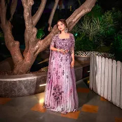A confident pose in this beautiful lavender outfit. The makeup is kept fresh and pretty to complement the vibrant color of the dress.