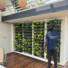 A member of my team tends to a vertical garden on this beautiful terrace. A garden like this is a perfect spot to enjoy a cup of chai, surrounded by greenery.