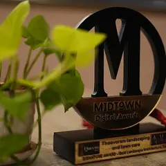 Another shot of our award, with a healthy plant in the foreground, representing our core mission of bringing green beauty to every space.
