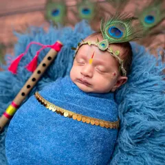 Another sweet pose from the little Krishna session, showing the baby peacefully sleeping with his flute. These sessions are a wonderful way to honor your faith and traditions.