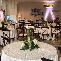 Another view of the corporate event setup, highlighting the beautiful floral centerpieces and the overall sophisticated ambiance I created overnight.
