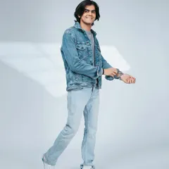 A dynamic, walking pose that brings a sense of movement and energy to the look.