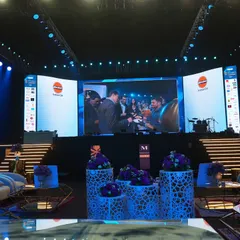 The main stage for the India Luxe Gourmet event, featuring a massive curved LED screen and professional lighting. The setup was designed to be impactful and provide a clear view for all attendees.
