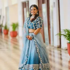 Nothing makes us happier than seeing our clients shine. This beautiful client is wearing one of our popular blue ombre lehengas, perfect for a wedding guest or bridesmaid. We altered it for her perfect fit, and she looks absolutely stunning.