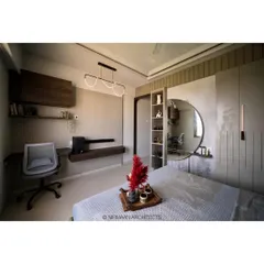 A multifunctional master bedroom design. We integrated a sleek study desk and a dresser with a large circular mirror, creating a space that is perfect for both work and relaxation.