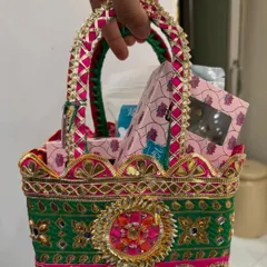 Create your own stunning festive hamper with us. This green and pink basket is packed with a selection of our most delectable homemade treats, perfect for Diwali gifting.