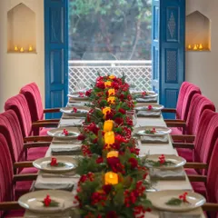 I design spaces for connection and celebration. This long table, set for a festive gathering, shows how our elegant interiors can be transformed for your special group events and private dining.
