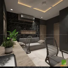 This view of the home office shows a comfortable sofa for taking breaks, as well as plants to bring a touch of nature indoors.