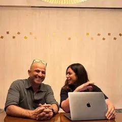 The design process is always a collaboration. Here I am in a meeting with a client, sharing ideas and laughing about the journey ahead. The best homes are born from these moments of connection and shared vision.