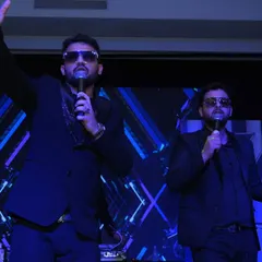 The lead singers of Dilli Rockers Band commanding the stage during a New Year's performance. I focus on capturing the artists' stage presence and energy.