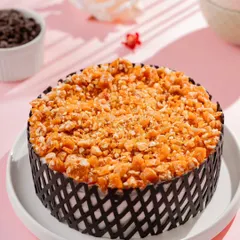 Our Praline Butterscotch Cake is pure bliss. It's a symphony of velvety layers, light whipped cream, and the irresistible crunch of cashew nougat.