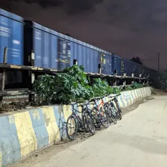 A perfectly timed moment. We stacked our cycles to watch a bright blue freight train pass by under a magnificent moon during our ride to Horamavu.