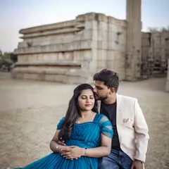 A tender moment captured at a historic stone location. The contrast between the soft romance and the ancient architecture is just beautiful.