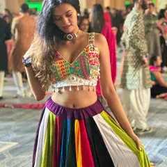 A close-up of my Navratri look. The detailed, colorful blouse and multi-paneled skirt are classic choices for an authentic Garba performance.