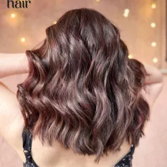 Mellow mahogany. A beautiful, soft take on red hair, with mahogany and copper tones blended for a warm and rich balayage.