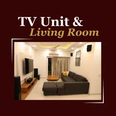 This living room setup features a comfortable L-shaped sofa, a minimalist TV unit, and a simple yet elegant false ceiling design with cove lighting, creating a cozy and modern space.
