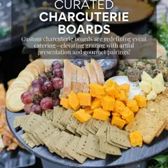 Our curated charcuterie boards are a cornerstone of modern event catering. This board highlights a balanced selection of cheeses, crackers, and fresh grapes, artfully arranged for both visual appeal and gourmet pairing.