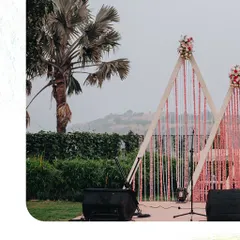 The stage setup for an outdoor event at Dukes Resort, Lonavala. We design decor that complements the natural beauty of the venue, creating a seamless blend of elegance and landscape for a destination wedding.