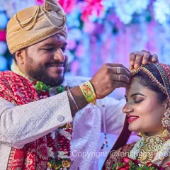 This is a tender moment during a Hindu wedding ceremony. I focused closely on the groom as he gently places the ornament on his bride's forehead, capturing his smile and her serene expression.
