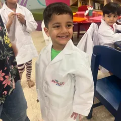 Look at that proud smile! Our little scientists love dressing up in lab coats for our hands-on STEM workshops, where they feel like real inventors.
