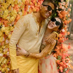 This is what I call sunshine chic. For this haldi, we created a stunning floral wall with an ombre of marigolds and roses, a modern twist on a traditional ceremony that perfectly matched the couple's vibrant energy.