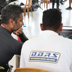 I'm here with a data analyst from DDRS, diving deep into a rider's telemetry. This data-driven approach helps us pinpoint exactly where a rider can improve their braking, acceleration, and cornering.