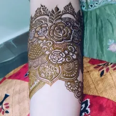 A close-up of a floral arm band. I love creating these intricate cuffs as part of a bridal design.