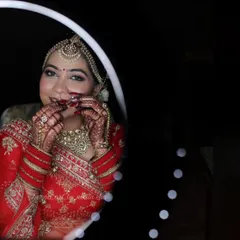 A stunning mirror shot of the bride, her smile as radiant as her mehendi. It's moments like these that make my work so rewarding.