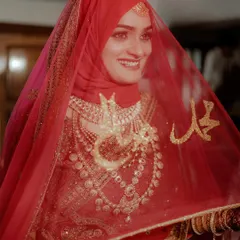The moment a bride is lost in her thoughts, veiled in tradition and dreams. This portrait of a Muslim bride in her stunning red attire is all about capturing that quiet grace and anticipation.