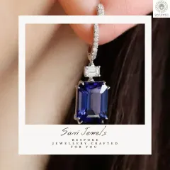 I love incorporating the deep, soulful colour of gemstones into my work. These drop earrings feature a stunning emerald-cut sapphire, perfectly balanced by the sparkle of baguette diamonds for a look of modern sophistication.