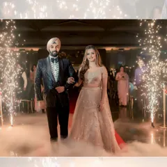 A fairytale entrance for Simran and Sanjit. They walk through a path of cold pyrotechnics and low-lying fog, creating a dreamy and cinematic moment.