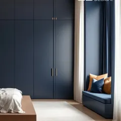 Storage should be seamless and elegant. These floor-to-ceiling wardrobes in a deep midnight blue provide ample space while adding a touch of sophisticated drama to the room. The minimal brass handles are a subtle, luxurious detail.