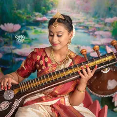 Here, we see the beautiful portrayal of Goddess Saraswati, the embodiment of knowledge and art. The intricate details, from the veena to the traditional saree, make this a timeless cultural portrait.