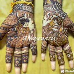 Your love story, drawn on your hands. This detailed bridal mehandi features beautiful portraits of the couple, making it a truly personal piece of art for your wedding.