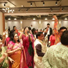 The energy is high as the family dances and celebrates during the Mayra. I am right there with them, cheering them on with the mic.