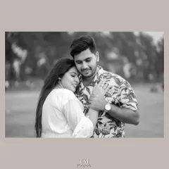 A tender black and white portrait of the couple in a gentle embrace. Monochrome photos often highlight the emotion of a moment, and this image is full of quiet affection.