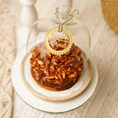 Our Almond Praline Teacake, specially dressed for Diwali. The reusable glass cloche makes it a gift that lasts long after the cake is gone.