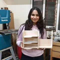 This student created a multi-level organizer with curved shelves, learning to use a jigsaw to cut complex shapes.