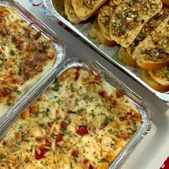The perfect pair: my veggie lasagna and herbed garlic bread. This is a complete and satisfying meal that your guests will be talking about long after the party is over.