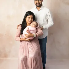 The first family portrait is a memory to cherish forever. I love bringing parents and their new baby together to capture the complete story of your family's love in a simple, elegant setting.