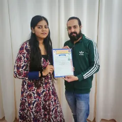 Presenting a student with her Diploma in Yoga certificate. It's an honor to guide aspiring teachers and help them achieve their goals.