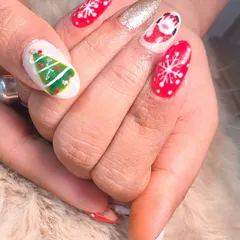 A close-up of my hand-painted Christmas designs, including a cute Santa, a Christmas tree, and snowflakes.