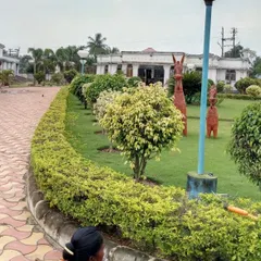 Our team provides ongoing maintenance for public parks and gardens. Here, a member of our crew is carefully trimming the hedges to maintain their neat shape, ensuring the space always looks its best.