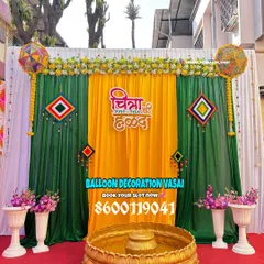 For a traditional Haldi ceremony, we use a classic combination of yellow and green drapes, marigold flowers, and personalized signage in Marathi for an authentic touch.