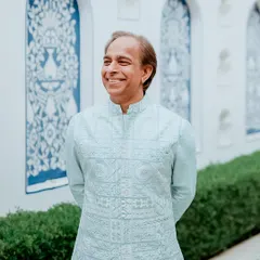 A stroll in style with Sanjay. This pastel bundi set, featuring timeless embroidery, was designed for the father of the groom, blending heritage with modern sophistication.