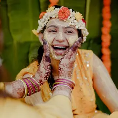 The beautiful, unrestrained laughter of a bride during her Haldi ceremony. My candid photography style is all about capturing these real, joyful expressions that you'll cherish forever.