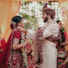The Varmala exchange is full of smiles and laughter. This shot captures the happiness of the couple and their families during one of the most joyful rituals of an Indian wedding.
