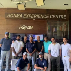 A Group Photo of Men's Golf Camp Participants: The Men's Golf Camp is about building skills and connections. Participants and instructors gather for a group photo at our Honma Experience Centre, celebrating a successful camp filled with learning and friendly competition.